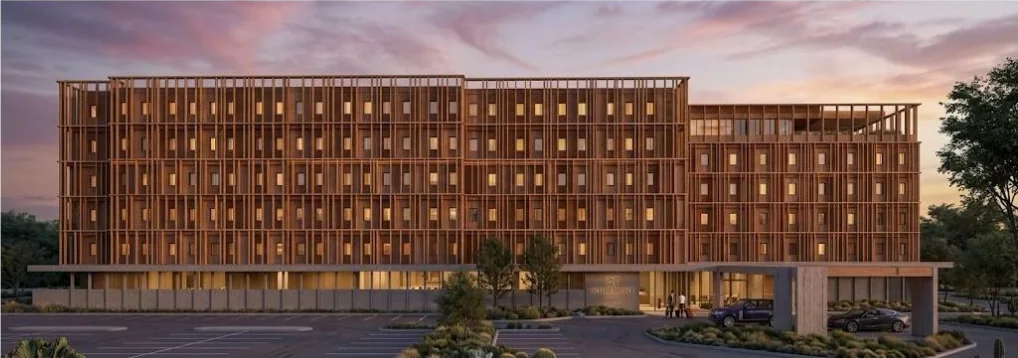 Hotel main façade and drop-off at dusk